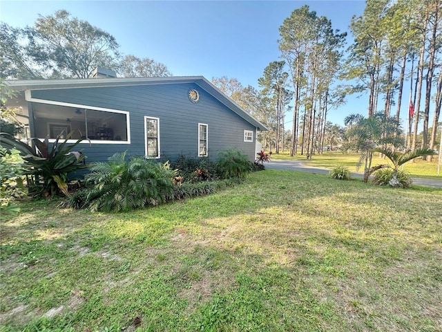 view of home's exterior with a lawn