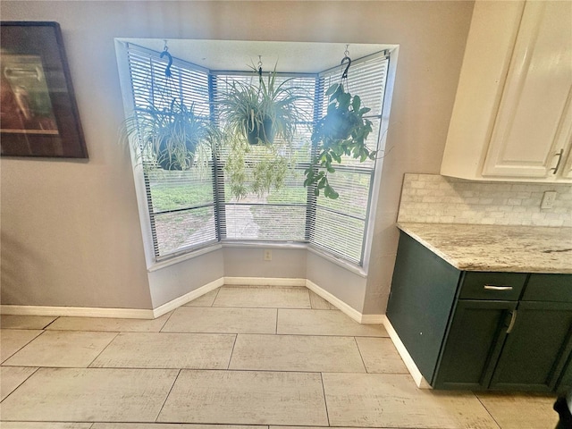 dining space featuring light tile patterned floors