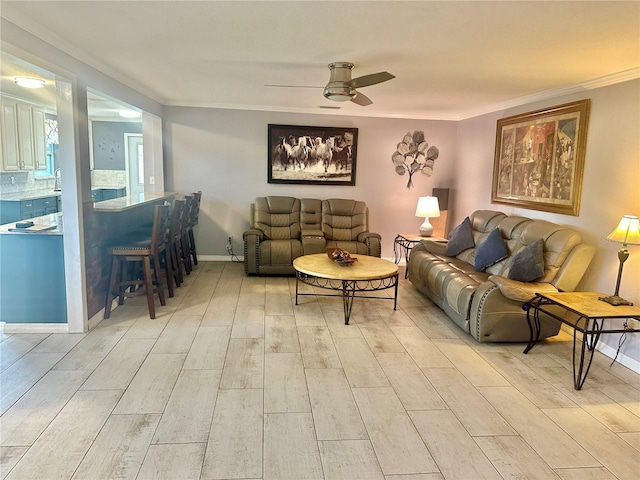 living room featuring ceiling fan and ornamental molding