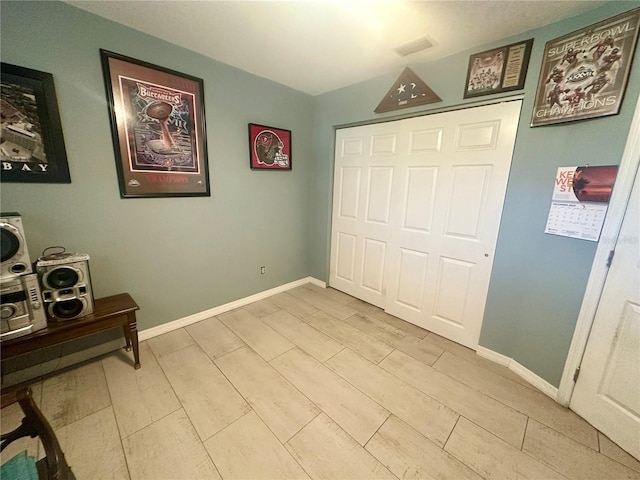 bedroom with a closet and light wood-type flooring