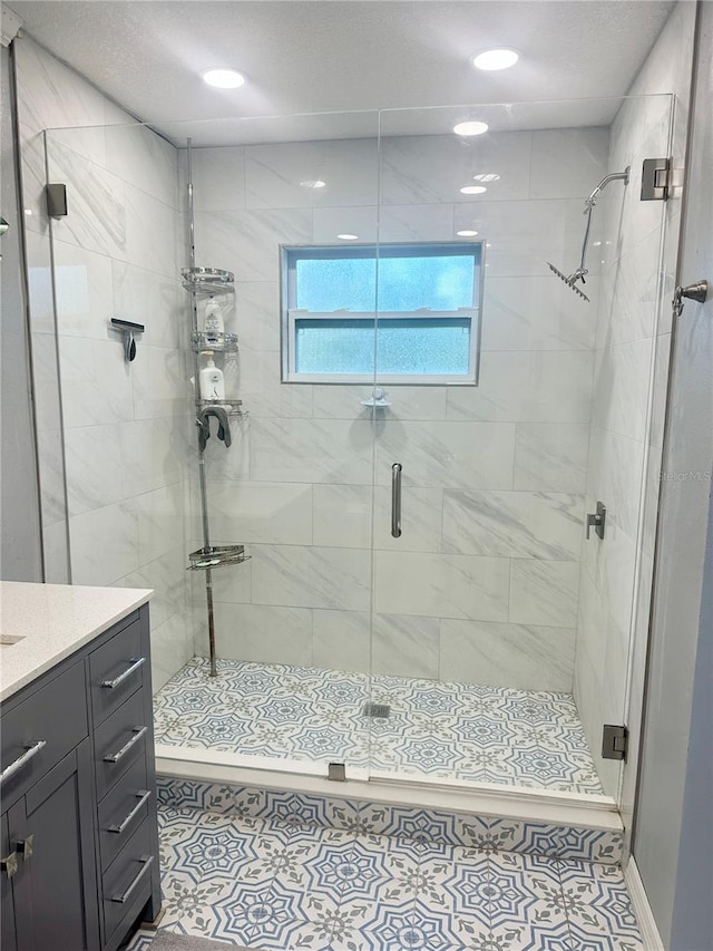 bathroom with vanity, tile patterned floors, and walk in shower