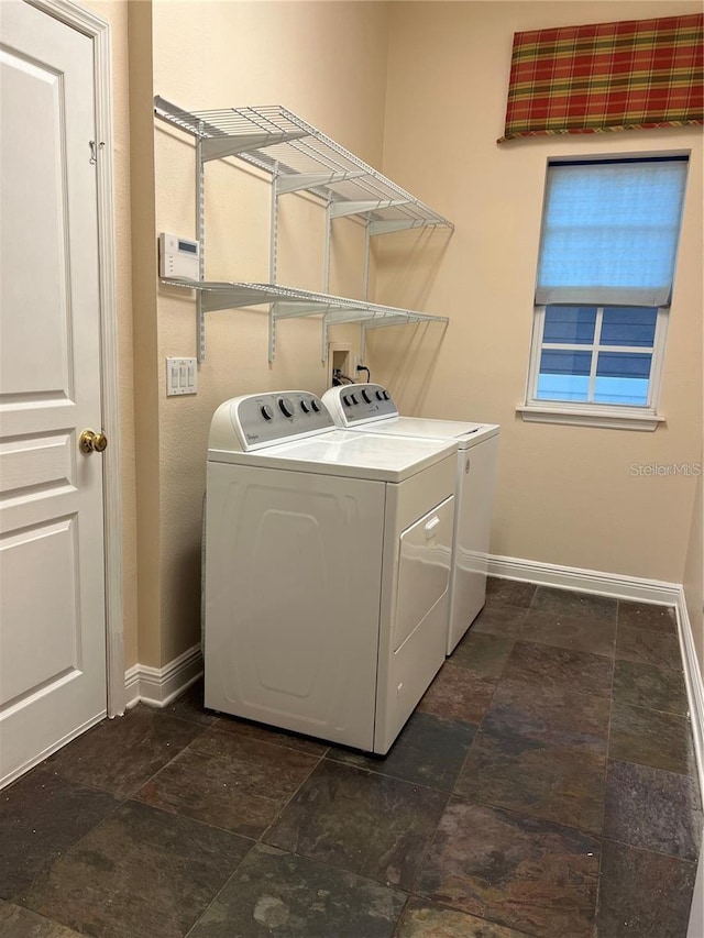 laundry room with washing machine and dryer