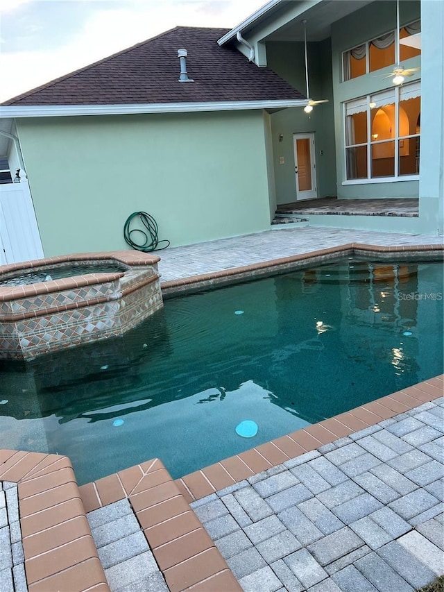 view of pool featuring an in ground hot tub and a patio