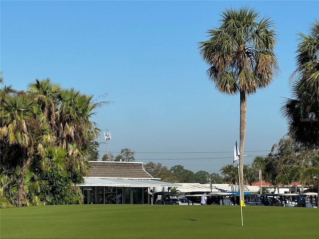 view of property's community with a yard