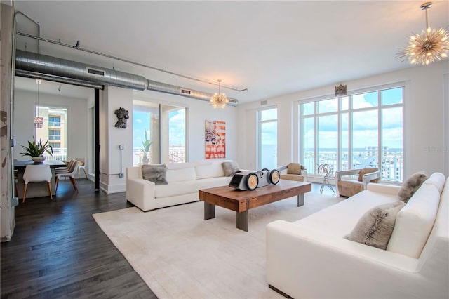 living room featuring hardwood / wood-style flooring and a chandelier