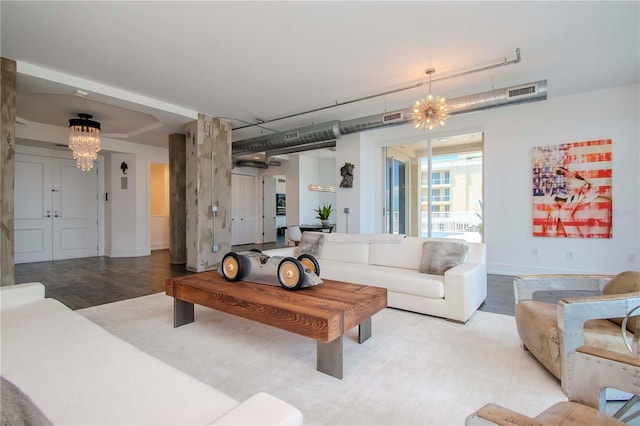 living room with a chandelier and light hardwood / wood-style flooring