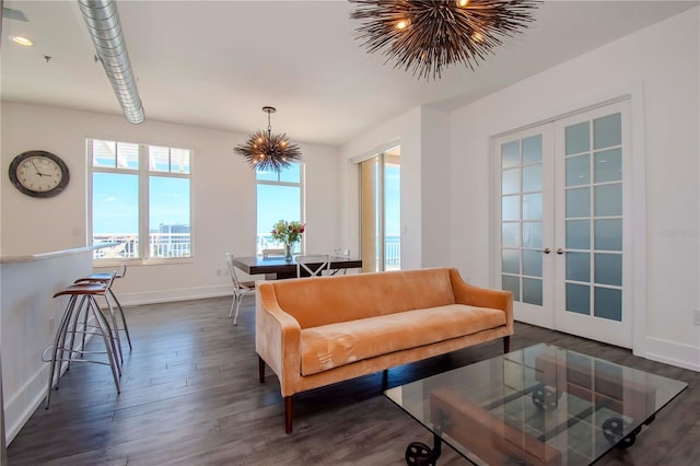 living room with french doors and dark wood-type flooring