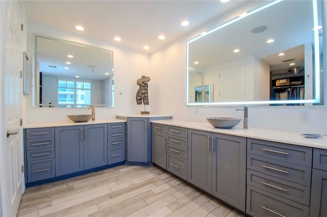 bathroom with vanity and hardwood / wood-style floors