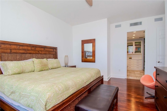 bedroom featuring dark hardwood / wood-style flooring