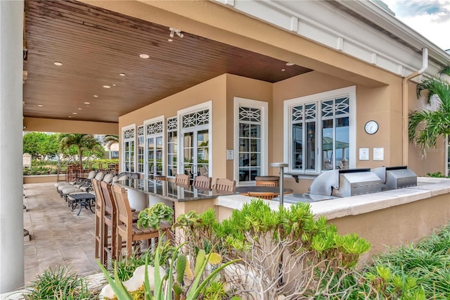 view of patio with an outdoor kitchen and area for grilling