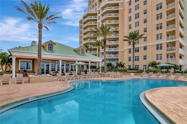 view of swimming pool with a patio area