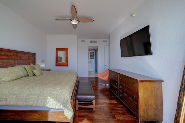 bedroom with dark wood finished floors, visible vents, and a ceiling fan