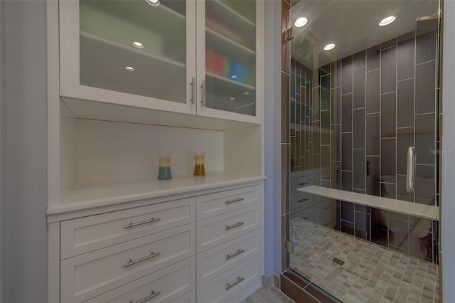 full bathroom with a stall shower, vanity, and recessed lighting