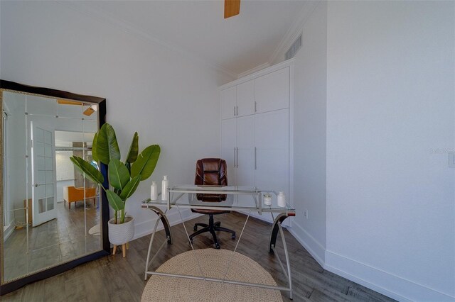 office area with ornamental molding, visible vents, baseboards, and wood finished floors