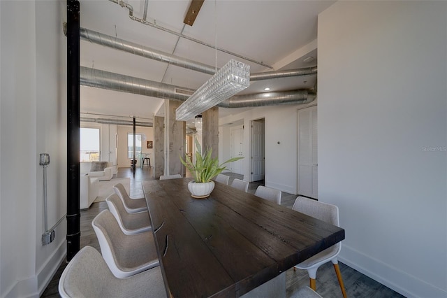 dining room with wood finished floors and baseboards