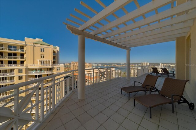 balcony featuring a view of city and a pergola