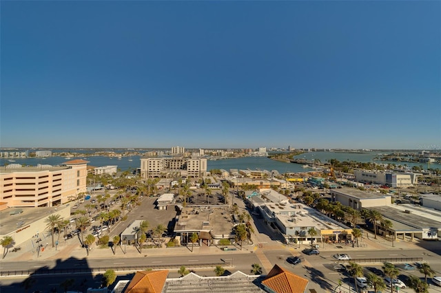 birds eye view of property featuring a water view and a city view