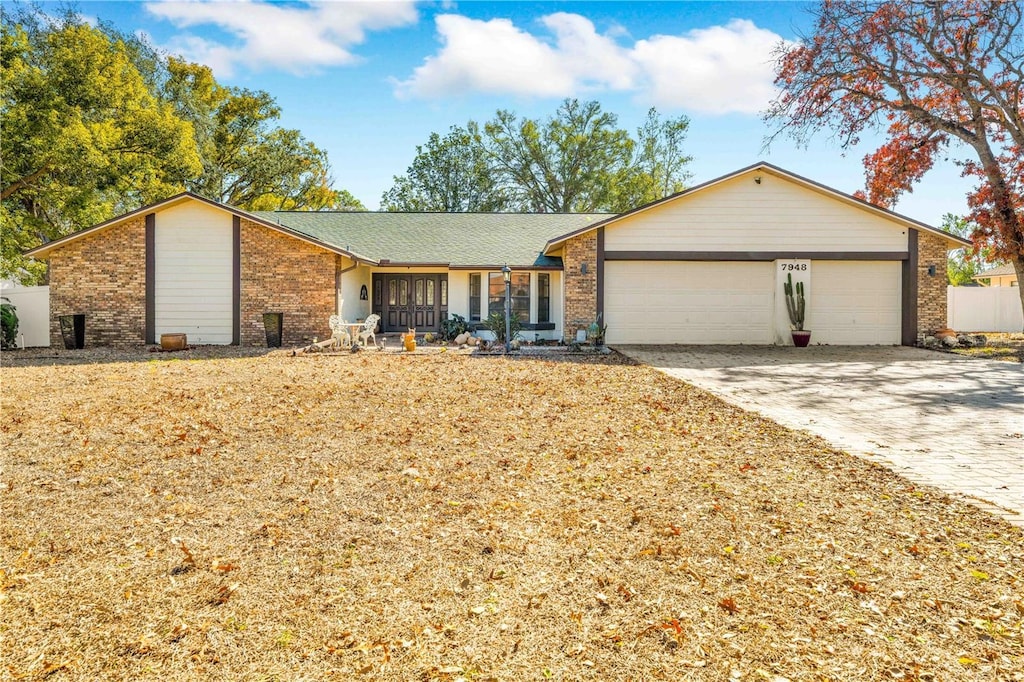 single story home with a garage