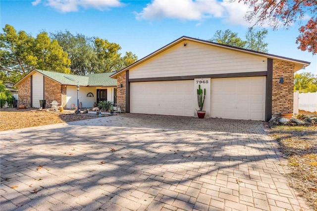 single story home featuring a garage