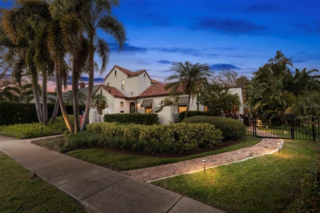 view of front of home with a lawn