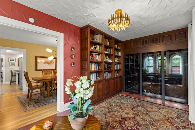 interior space with hardwood / wood-style flooring and a textured ceiling