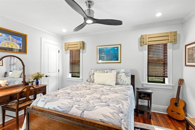 bedroom with ceiling fan, ornamental molding, and wood-type flooring