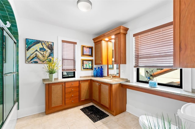 interior space featuring sink and light tile patterned floors