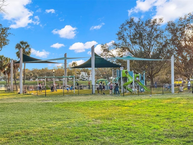 view of jungle gym featuring a lawn