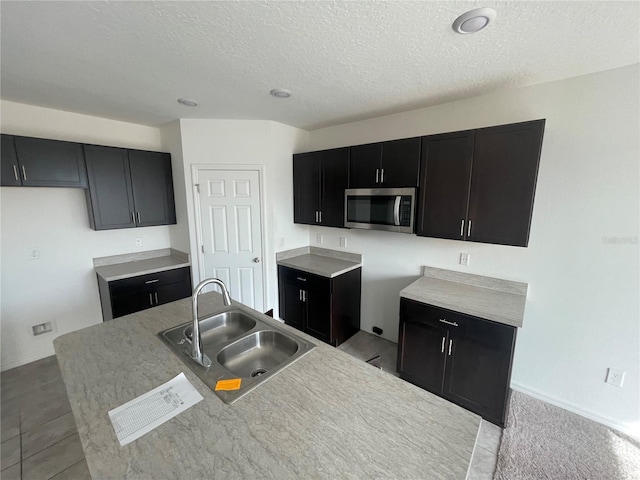 kitchen with sink and a textured ceiling