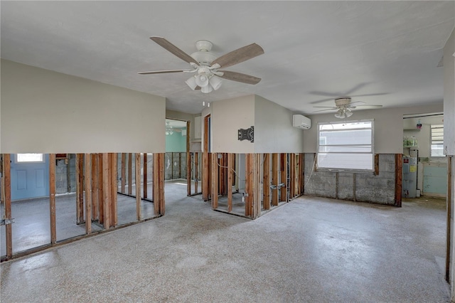 spare room featuring water heater and a wall mounted AC