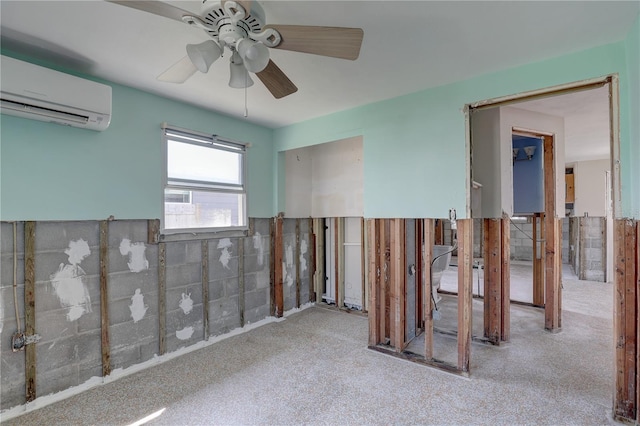 unfurnished room featuring ceiling fan and a wall mounted AC