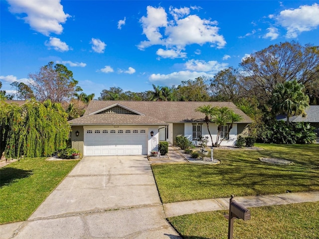 single story home featuring a garage and a front yard