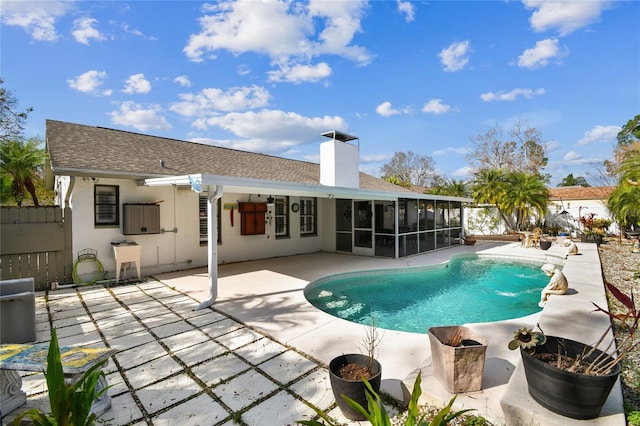 back of house featuring a patio area, a sunroom, and pool water feature