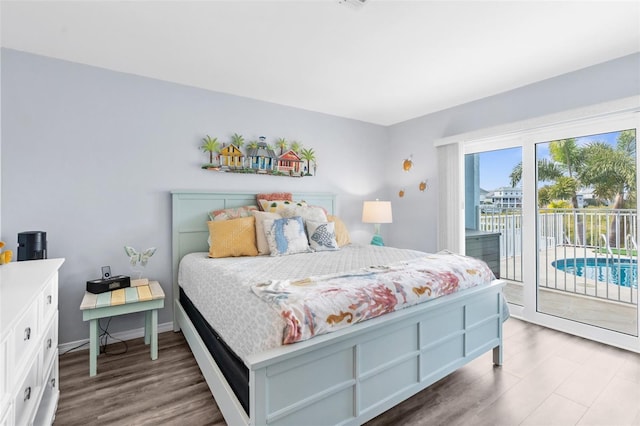 bedroom featuring hardwood / wood-style flooring and access to outside