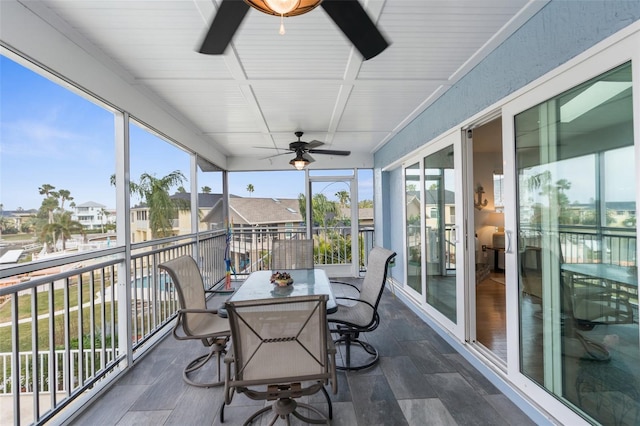 sunroom / solarium with ceiling fan