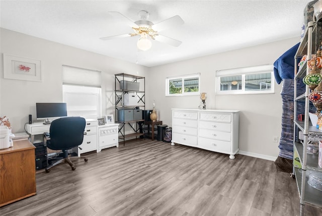 office area with hardwood / wood-style floors, a textured ceiling, and ceiling fan