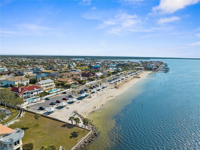 birds eye view of property featuring a view of the beach and a water view