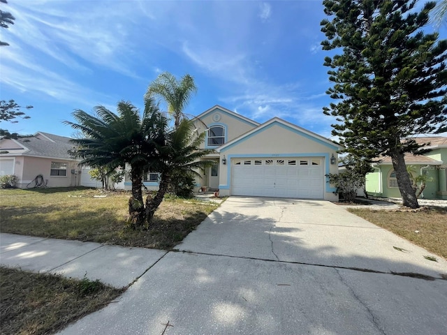 view of front of home featuring a garage and a front yard