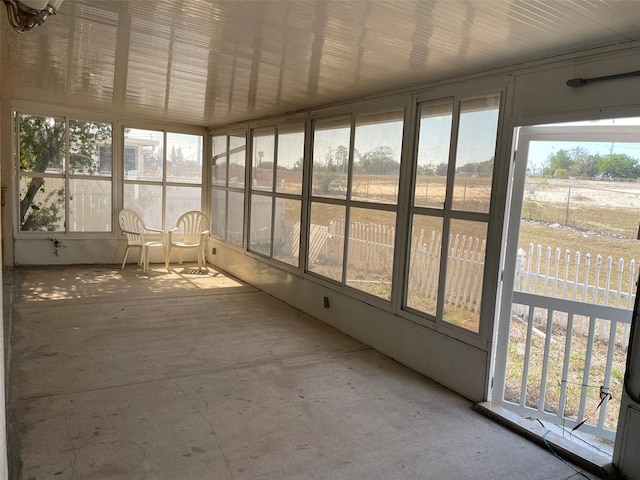 unfurnished sunroom featuring a healthy amount of sunlight