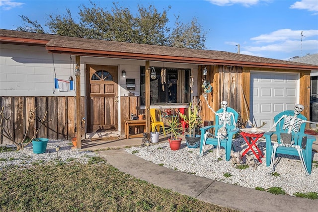 ranch-style home featuring a garage