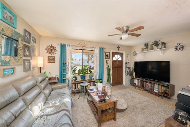 carpeted living room featuring ceiling fan