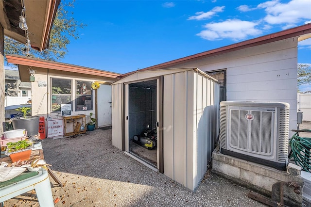 view of outbuilding with cooling unit