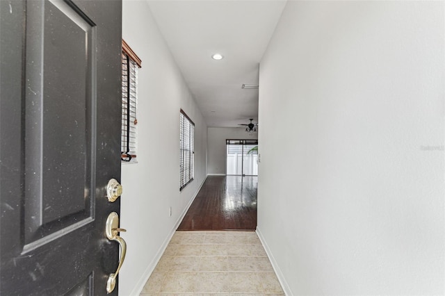 hallway featuring light tile patterned flooring