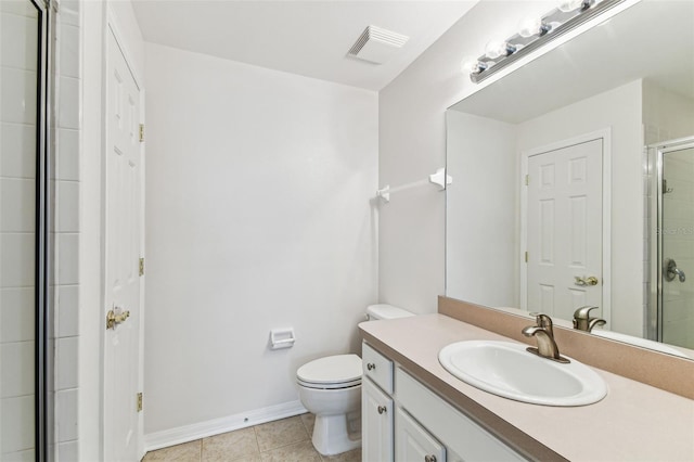 bathroom featuring an enclosed shower, vanity, tile patterned floors, and toilet