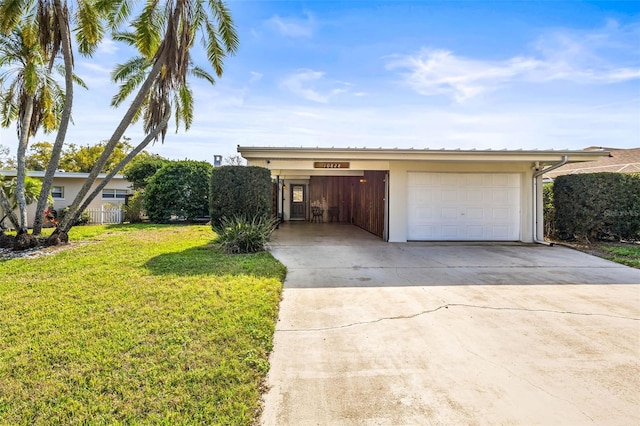 view of front of house with a garage and a front yard