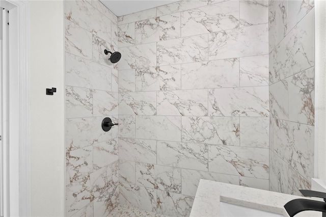 full bathroom featuring tiled shower