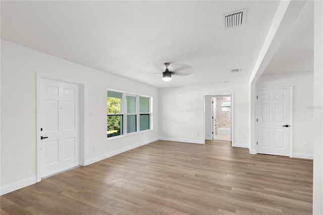 interior space with a wealth of natural light, visible vents, and light wood-style floors