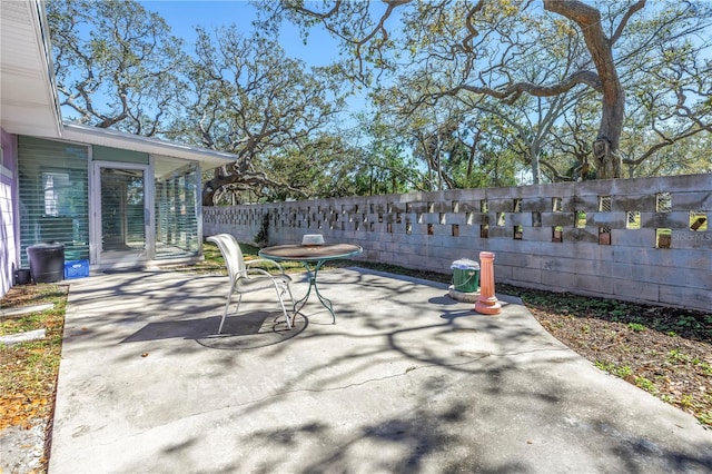 view of patio / terrace featuring fence