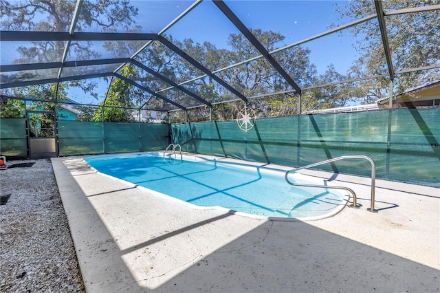 view of pool featuring a patio, a lanai, a fenced in pool, and fence