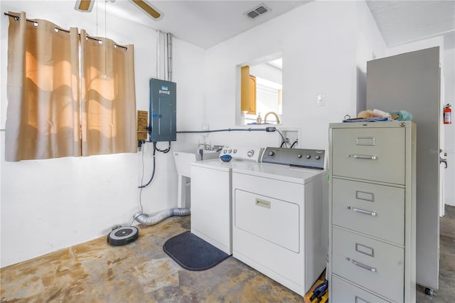 clothes washing area with washer and clothes dryer, visible vents, a ceiling fan, laundry area, and electric panel